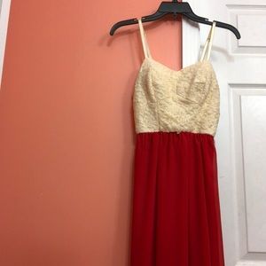 Red and tan high low dress.